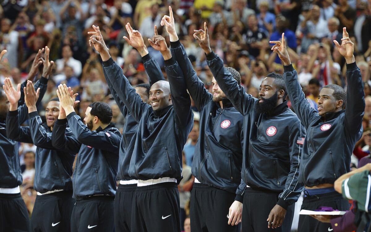 Members of the U.S. basketball team celebrate after winning the gold medal at the 2012 London Summer Olympics.