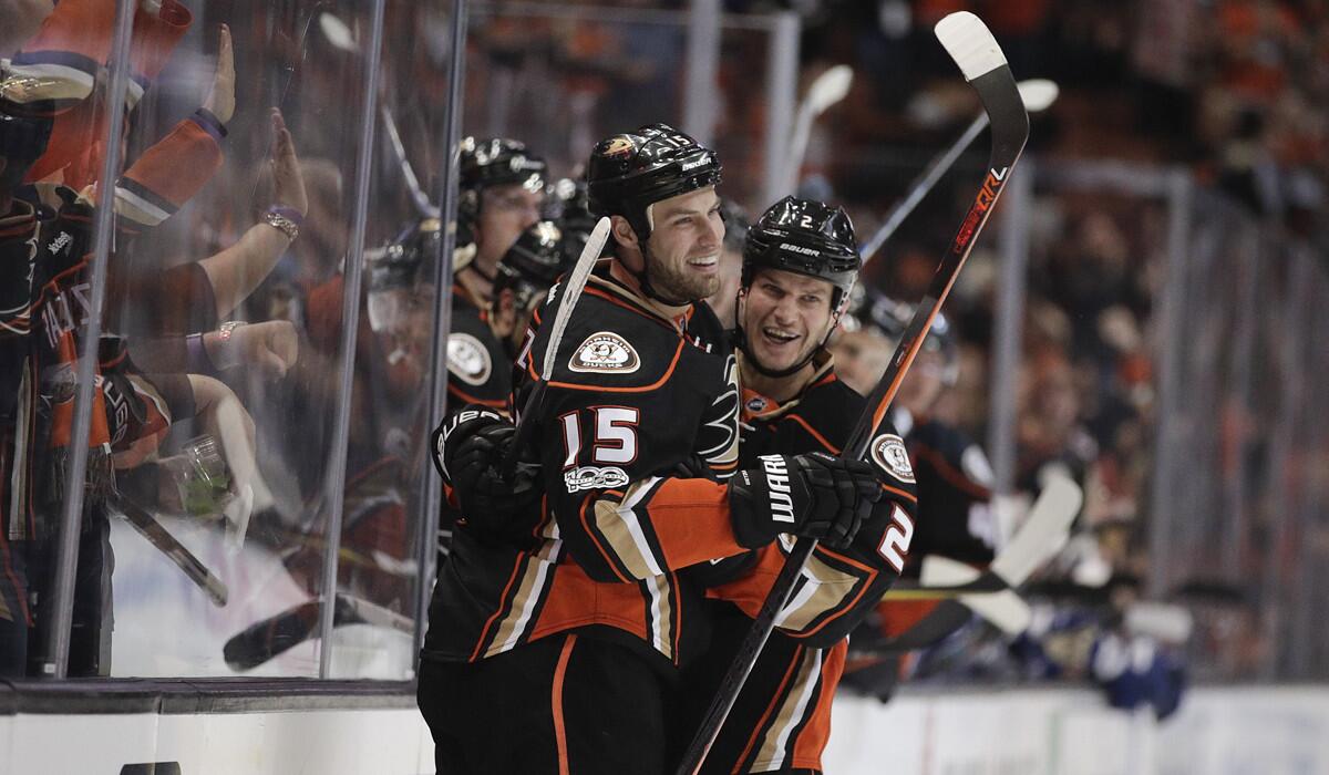 Ducks' Ryan Getzlaf, left, celebrates his goal with Kevin Bieksa during the second period against the Tampa Bay Lightning on Tuesday.