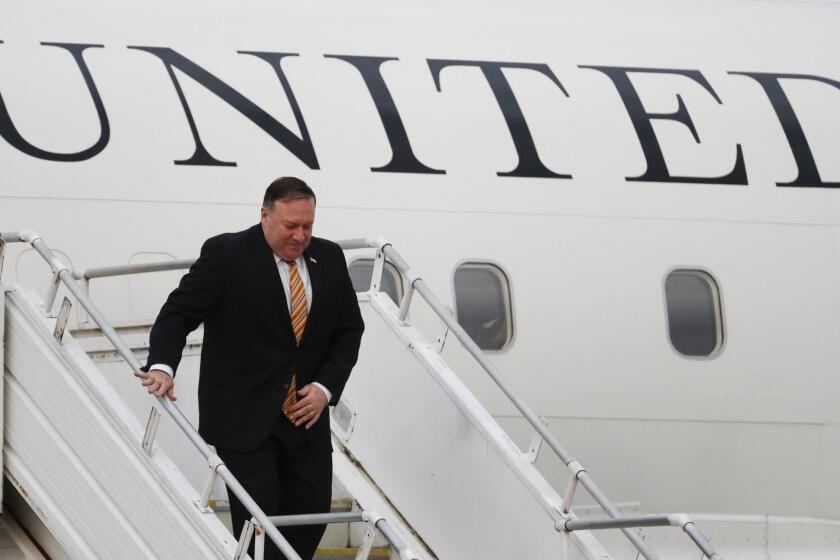 U.S. Secretary of State Michael Pompeo walks out from the plane as he arrives at the military airport in Subang, outside Kuala Lumpur, Thursday, Aug. 2, 2018. Pompeo will meet senior Malaysian officials to discuss strengthening the Comprehensive Partnership and advancing common security and economic interests. (AP Photo/Vincent Thian)