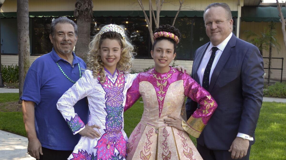Civitan President Randy Garcia, left, and Vice President Richard Bertain, welcoming O'Connor School of Dance performers Piper Cognata, left, and Julianna James.