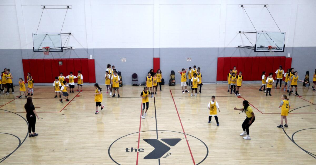 About 50 children participated in the L.A. Sparks & DEA 360 basketball clinic at the YMCA in Burbank on Wednesday, Feb. 12, 2020.