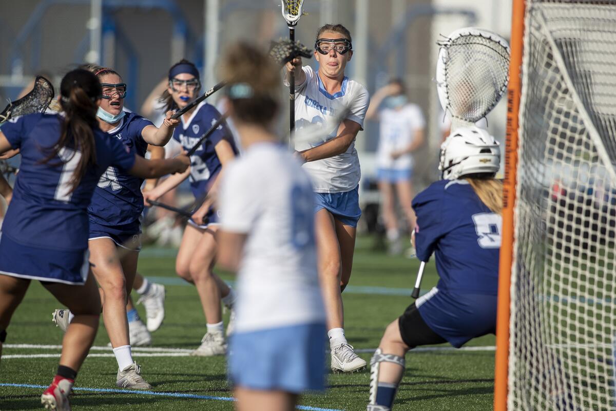 Corona del Mar's Isabelle Grace takes a shot on goal during a Sunset League match against Newport Harbor on Tuesday, May 11.