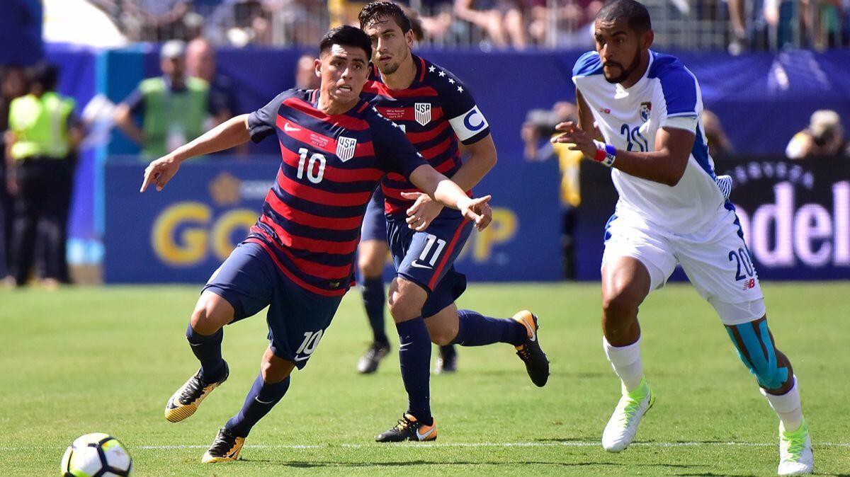 Panama's Anibal Godoy (20) chases United States' Joe Corona during the first half of a CONCACAF Gold Cup Soccer match at Nissan Stadium on Saturday in Nashville, Tenn.