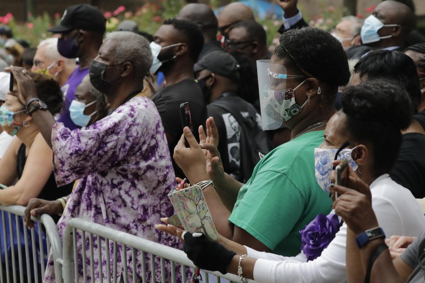 Mourners stand outside Ebenezer Baptist Church during the funeral for Rep. John Lewis