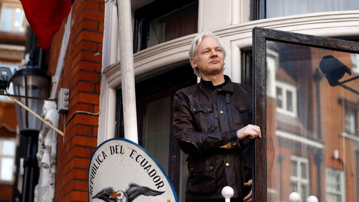 WikiLeaks founder Julian Assange greets supporters outside the Ecuadorean embassy in London on May, 19, 2017.