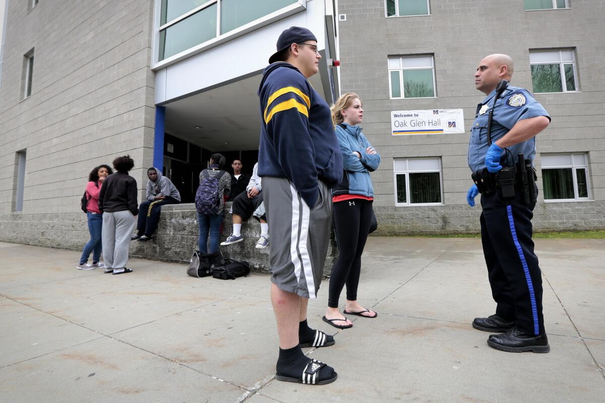 University of Massachusetts Dartmouth students are evacuated from campus Friday as officials investigate the dorm room of Boston Marathon bombing suspect Dzhokhar Tsarnaev.