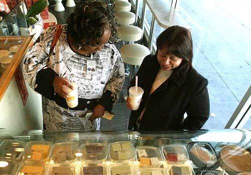 Diners ponder their choices of pan-Asian sweets in Phoenix Desserts' gleaming cases.
