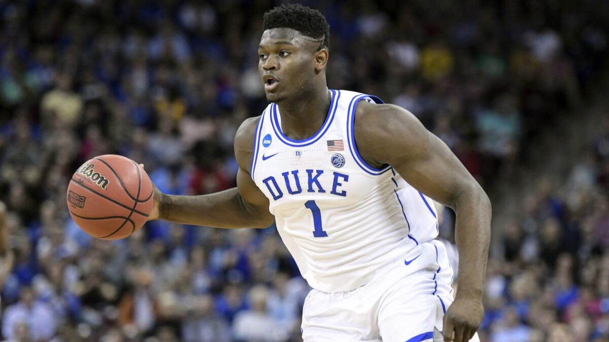 Duke forward Zion Williamson (1) dribbles the ball against Central Florida during the first half of a second-round game in the NCAA tournament in Columbia, S.C. on March 24.
