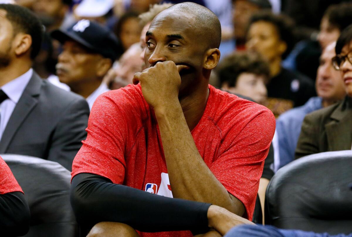 Lakers guard Kobe Bryant sits on the bench during the first half of a game against the New Orleans Pelicans on Jan. 21.