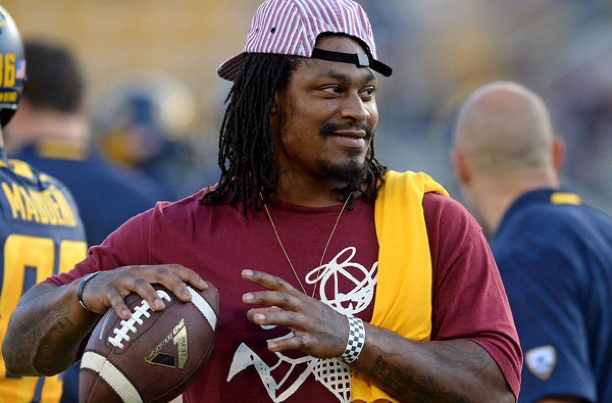 Seahawks running back Marshawn Lynch plays catch before watching his former college team, California, play Northwestern in a nonconference game.
