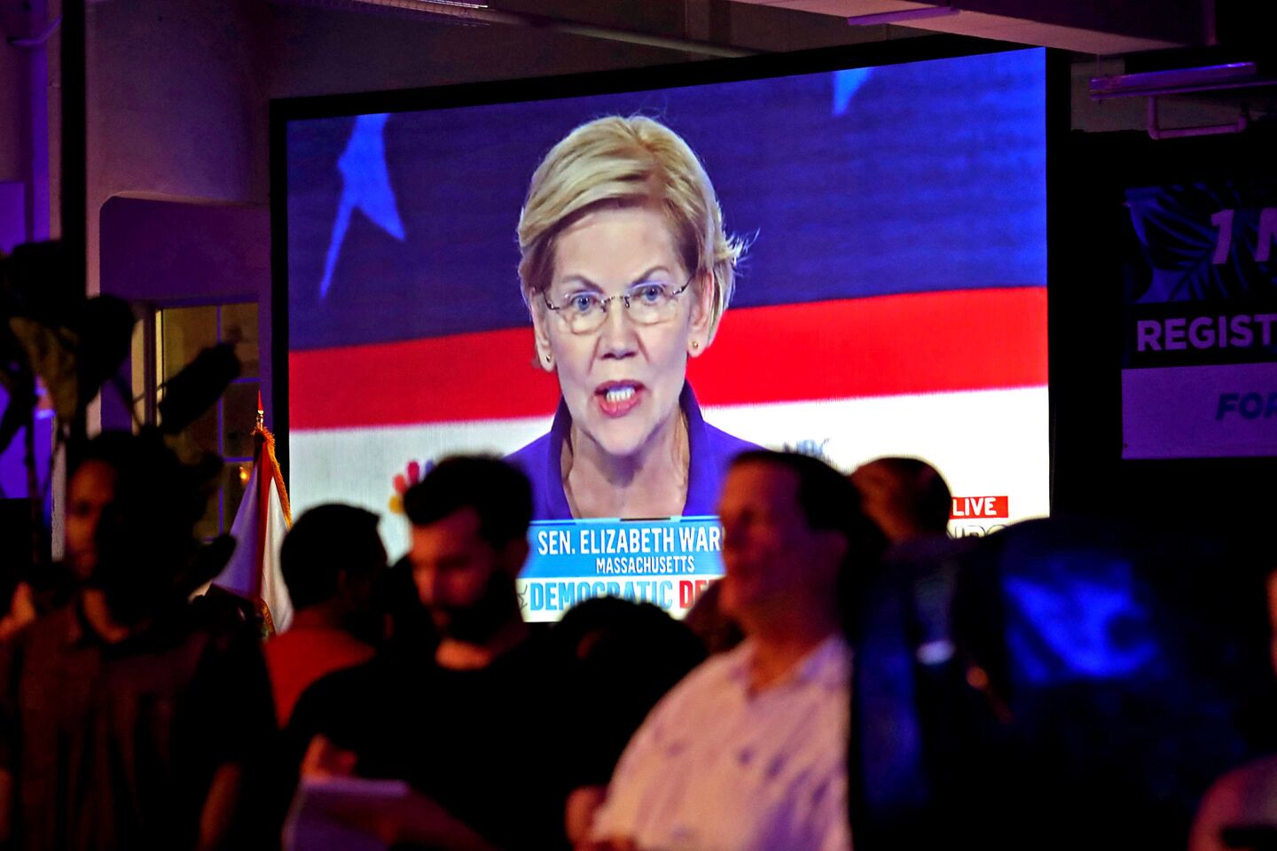 Sen. Elizabeth Warren (D-Mass.) is seen on a television at a watch party for the first Democratic presidential primary debates for the 2020 elections in Miami on Wednesday, June 26, 2019.