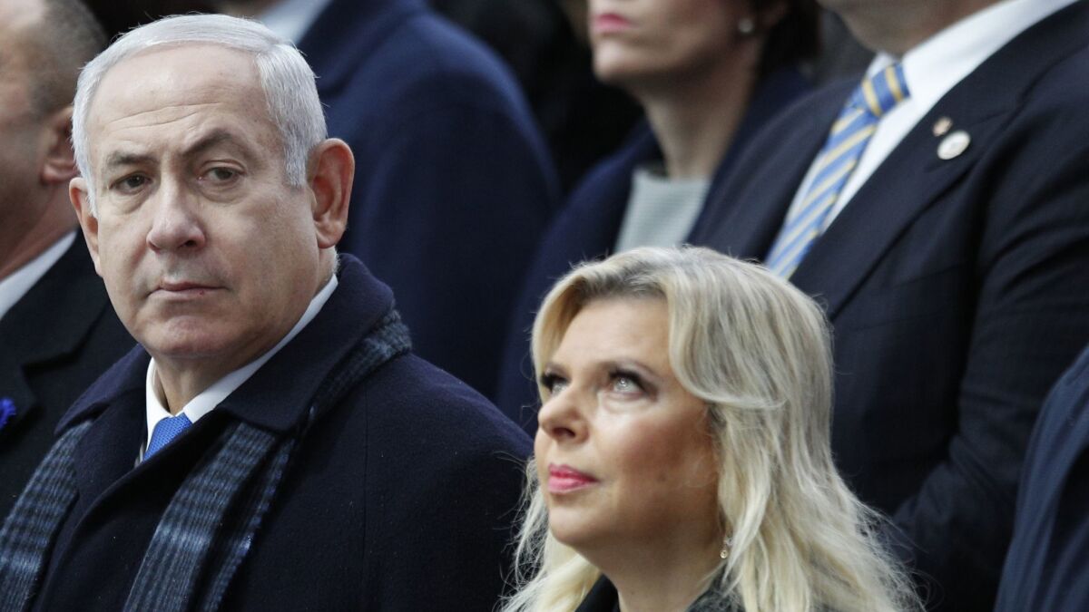 Israeli Prime Minister Benjamin Netanyahu and his wife, Sara, attend ceremonies at the Arc de Triomphe in Paris on Nov. 11.