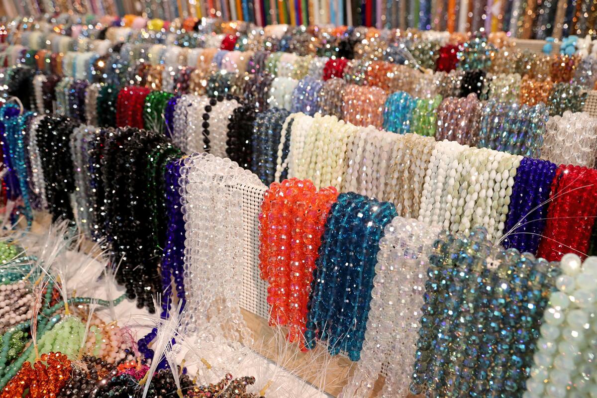 Bead strands on display Friday at the Gem Faire, held Costa Mesa's O.C. fairgrounds, August 27, 2021.