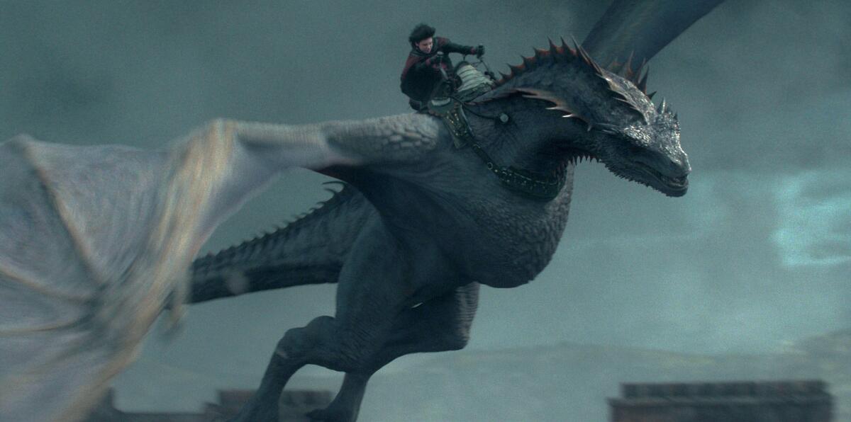 A young prince rides a dragon through the skies in a climactic "House of the Dragon" battle.