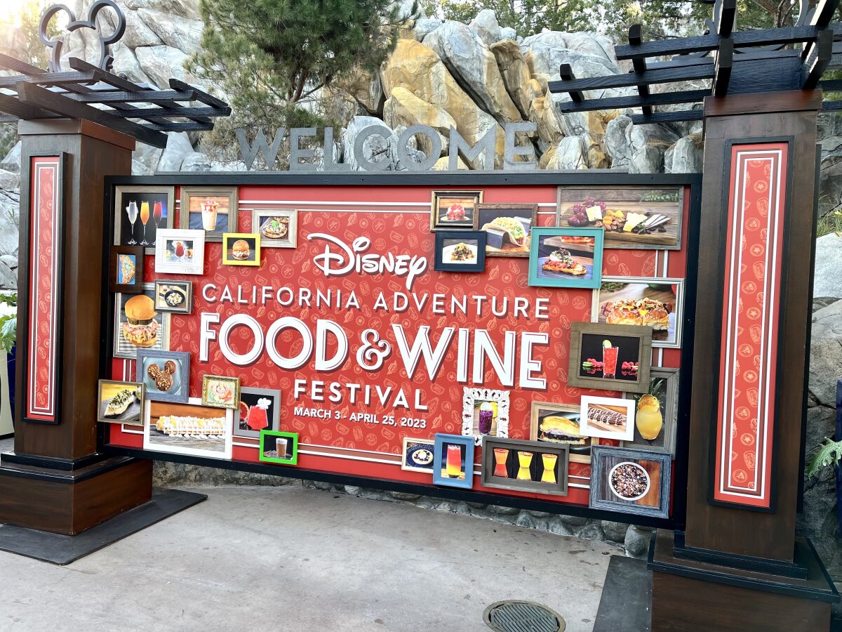 A sign welcomes visitors on opening day, March 3, 2023, to the Disney California Adventure Food & Wine Festival in Anaheim.