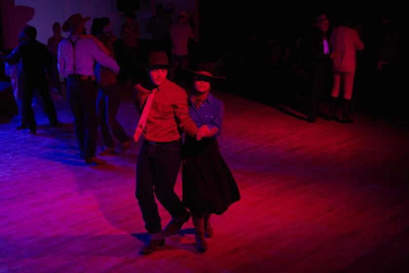 Johnny Reedy, left, and sister Brigid Reedy dance together during the "Midnight Dance" at the National Cowboy Poetry Gathering in Elko, Nevada on Feb. 4, 2023.