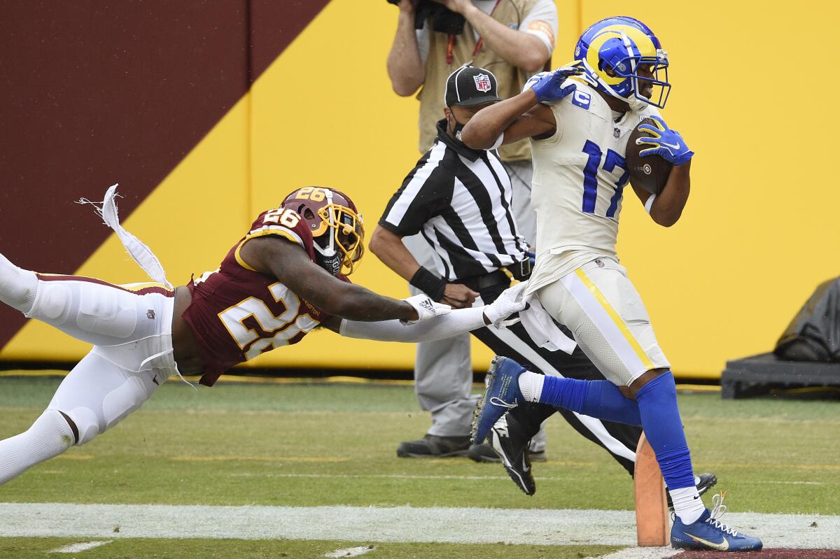 Rams receiver Robert Woods runs for a a touchdown past Washington's Landon Collins to complete a 56-yard pass play.