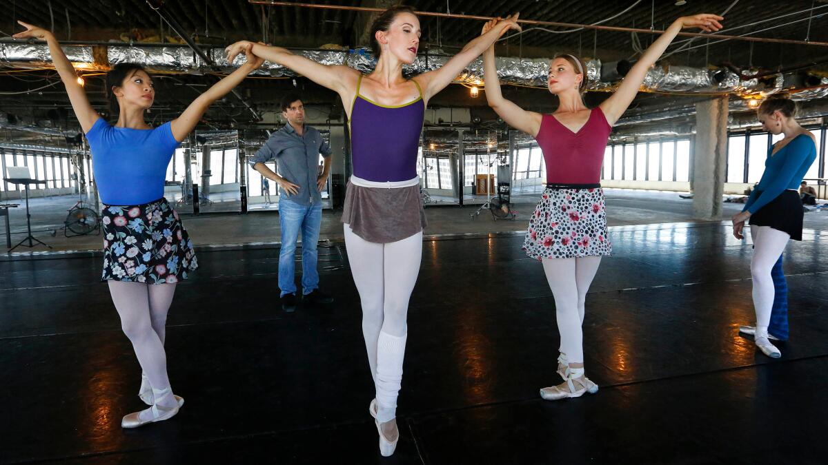 American Contemporary Ballet dancer Emily Parker, flanked by Rochelle Chang, left, and Raffaella Stroik, rehearses under the eye of choreographer Lincoln Jones.