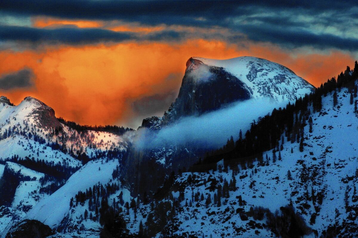 Half Dome in Yosemite National Park at sunset on a winter evening.