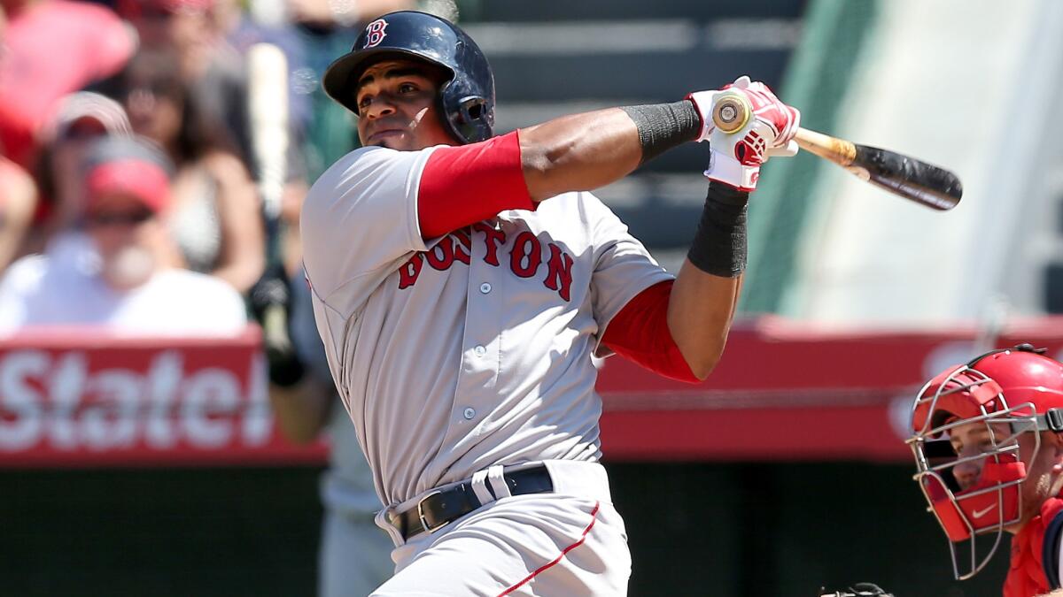 Boston Red Sox outfielder Yoenis Cespedes hits a three-run home run against the Angels on Aug. 10.