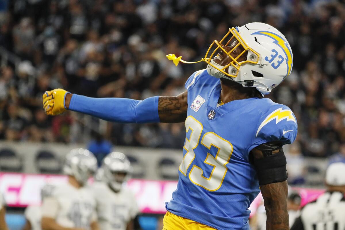 Chargers free safety Derwin James celebrates after stopping the Raiders on third down in the first half of Monday's win.