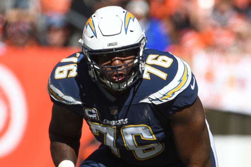 CLEVELAND, OH - OCTOBER 14, 2018: Offensive tackle Russell Okung #76 of the Los Angeles Chargers awaits the snap in the second quarter of a game against the Cleveland Browns on October 14, 2018 at FirstEnergy Stadium in Cleveland, Ohio. Los Angeles won 38-14. (Photo by: 2018 Nick Cammett/Diamond Images/Getty Images)