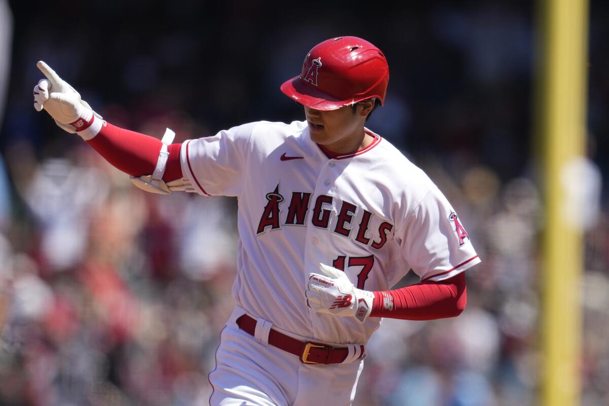 Angels designated hitter Shohei Ohtani rounds the bases after hitting a home run Sunday against the Toronto Blue Jays.