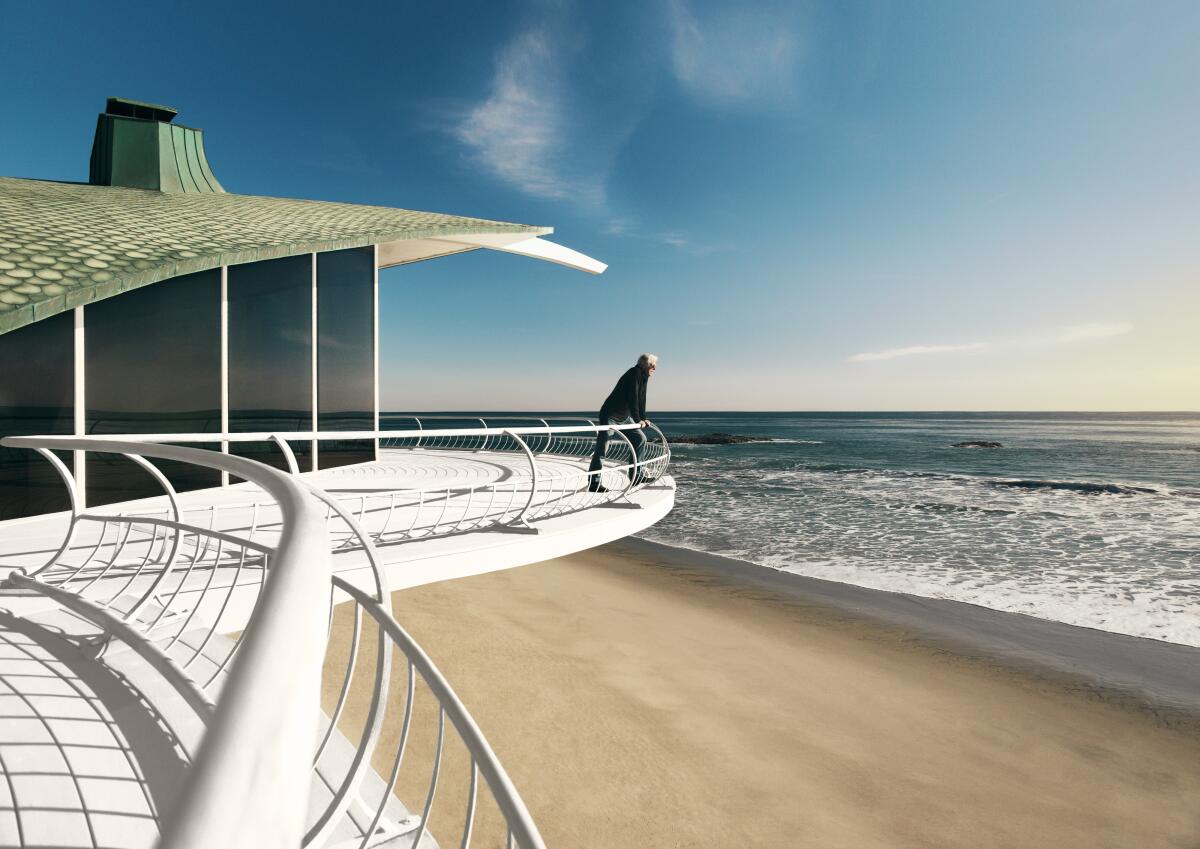 Architect Harry Gesner is seen leaning over the banister of an ocean-view deck of the Wave House