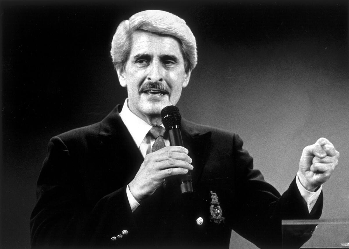 Trinity Broadcasting Network founder Paul Crouch delivers his message of faith and praise at a revival meeting held in the Cathedral of Light in Selma, Calif., on Aug. 18, 1988.