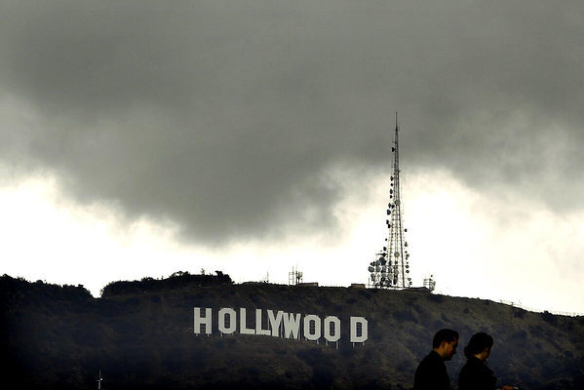 Dark clouds hover above the Hollywood sign on Monday.