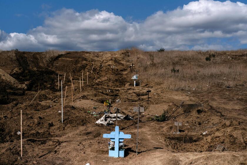 TOPSHOT - View of new common graves -needed due to the increase in the number of murders in the past months- at a cemetery in Tijuana, Baja California State, Mexico, on November 22, 2019. - AFP has mobilized several of its photographers in Mexico around a project entitled Twenty-four hours in Mexico in the shadow of violence to capture, from Thursday, November 21 at midnight to Friday, November 22, scenes of ordinary violence. Since December 2006, after the beginning of the federal anti-cartel offensive, there have been more than 250,000 murders reported in Mexico. (Photo by Guillermo Arias / AFP) (Photo by GUILLERMO ARIAS/AFP via Getty Images)