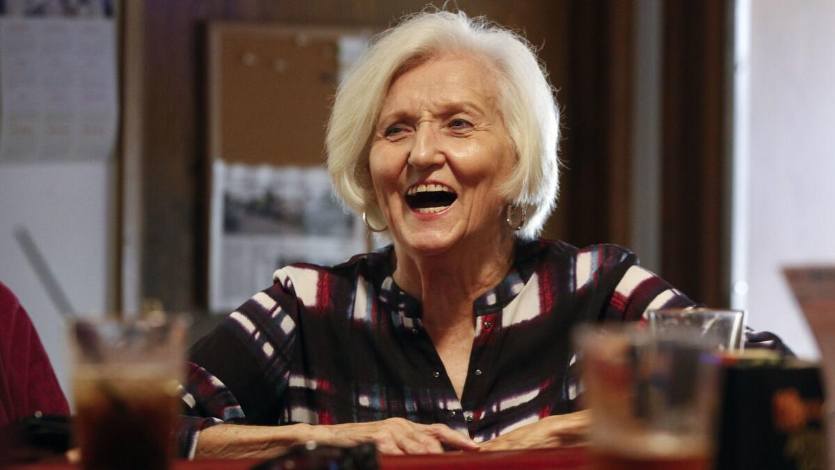 Carole Littlefield shares a laugh as she sits at the bar at VFW Post 3783.