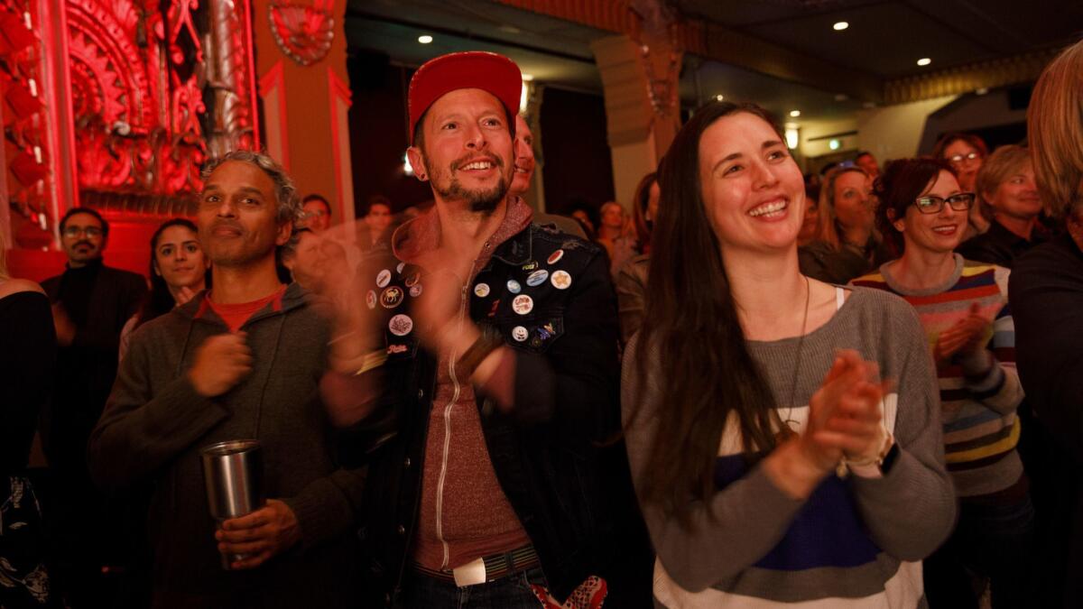 Attendees applaud Marianne Williamson during the announcement of her presidential campaign at the Saban Theatre in Beverly Hills.