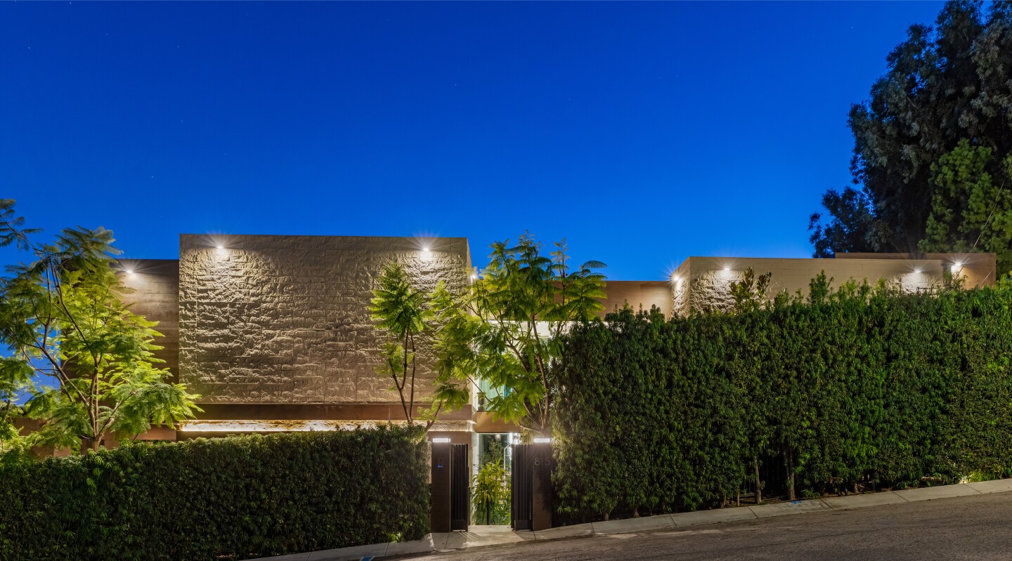 Built in 2018, the boxy abode spans three stories with a movie theater, bar, yoga studio and wine cellar.