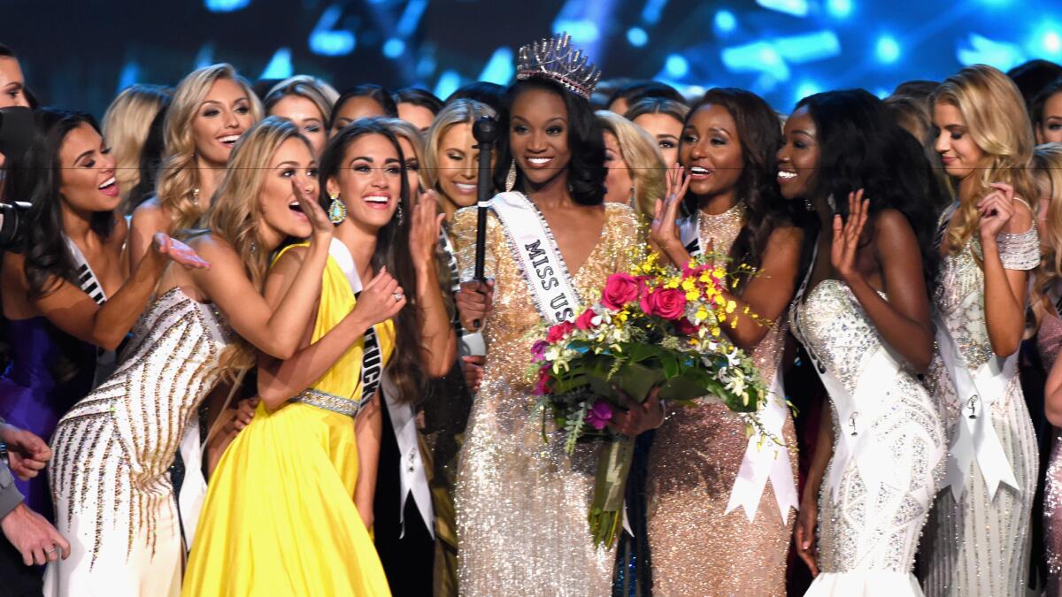 Miss District of Columbia Deshauna Barber, center, poses for a selfie with the other contestants after she is crowned Miss USA 2016 in Las Vegas on June 5.