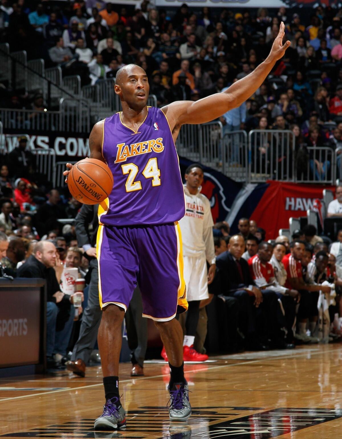 Lakers star Kobe Bryant calls out a play during the first half of Monday's game against the Atlanta Hawks.