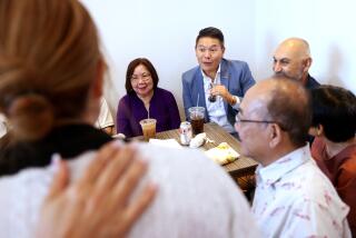 WESTMINSTER AND GARDEN GROVE-CA-AUGUST 17, 2024: Democrat Derek Tran, who is hoping to unseat Republican Rep. Michelle Steel in California's 45th Congressional District, center, has lunch with supporters at Carrot and Daikon Banh Mi in Little Saigon on August 17, 2024. (Christina House / Los Angeles Times)