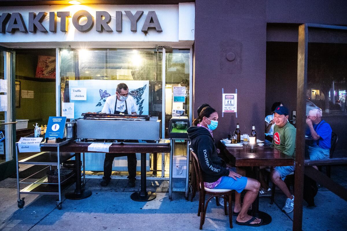 Chef Toshi Sakamaki prepares yakitori outdoors