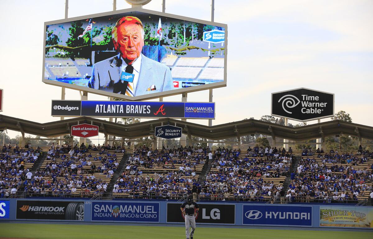 Vin Scully on the big screen at Dodger Stadium in 2014. Will more Dodger fans be able to watch him on their television screens soon?