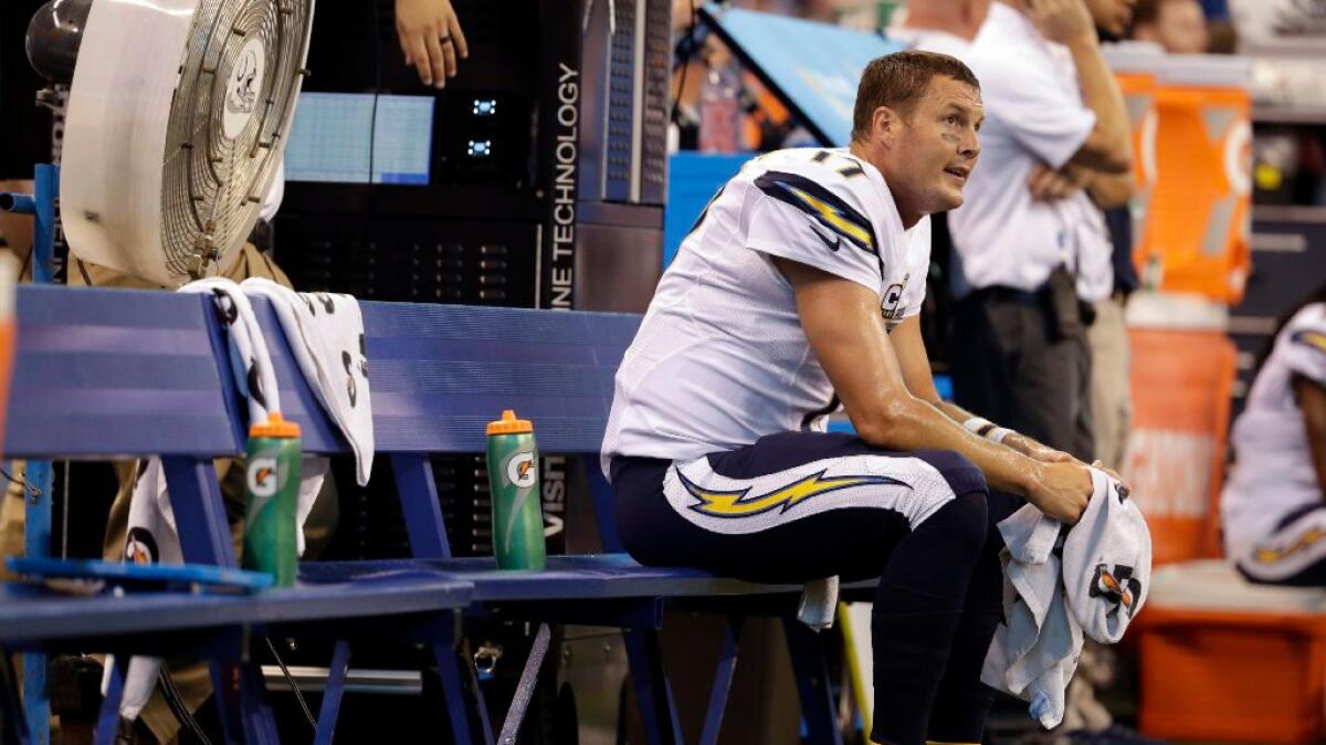 Chargers quarterback Philip Rivers sits on the bench during a game against the Indianapolis Colts on Sept. 25.