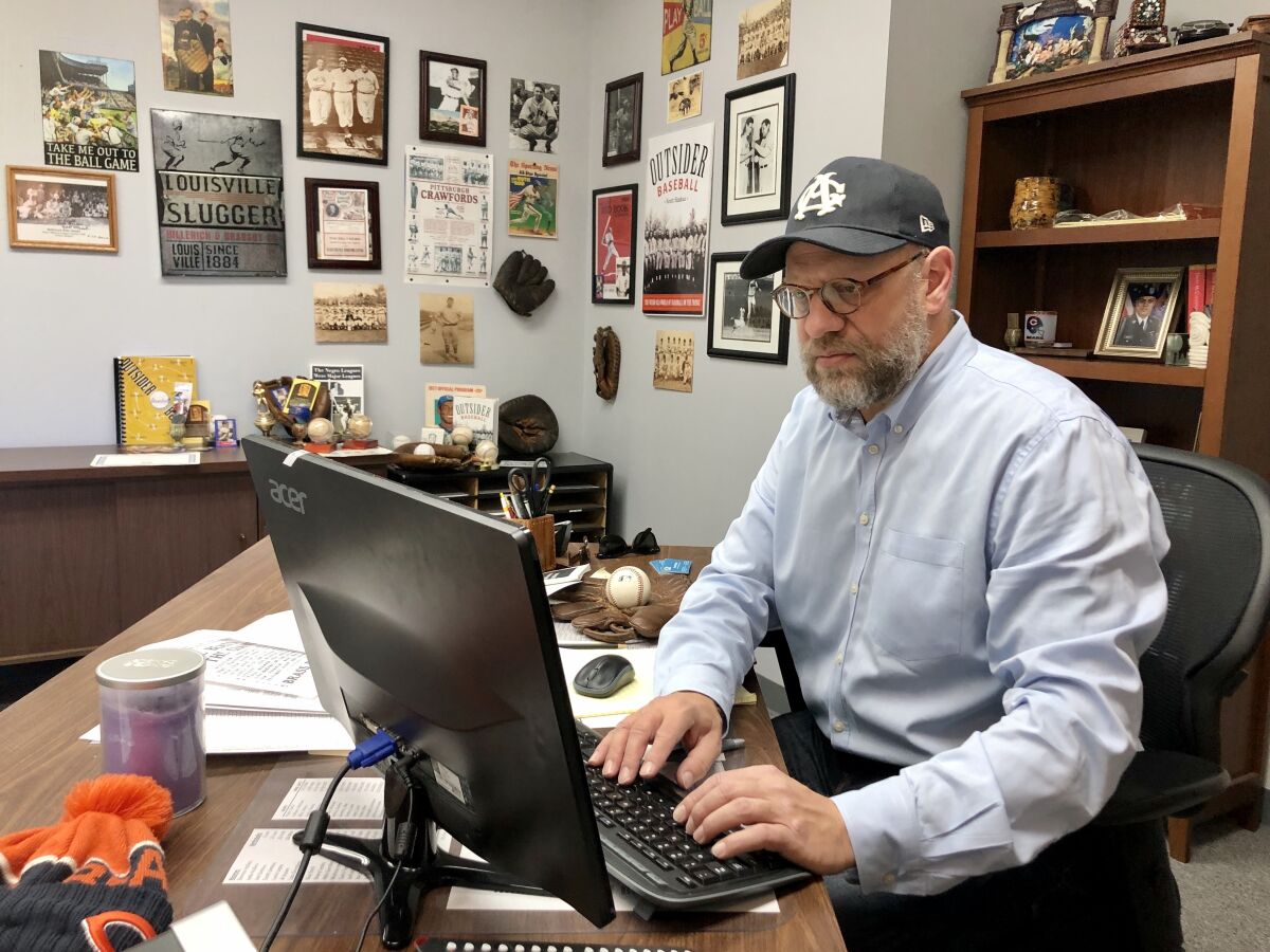 Negro Leagues historian Scott Simkus, working in his Chicago office.