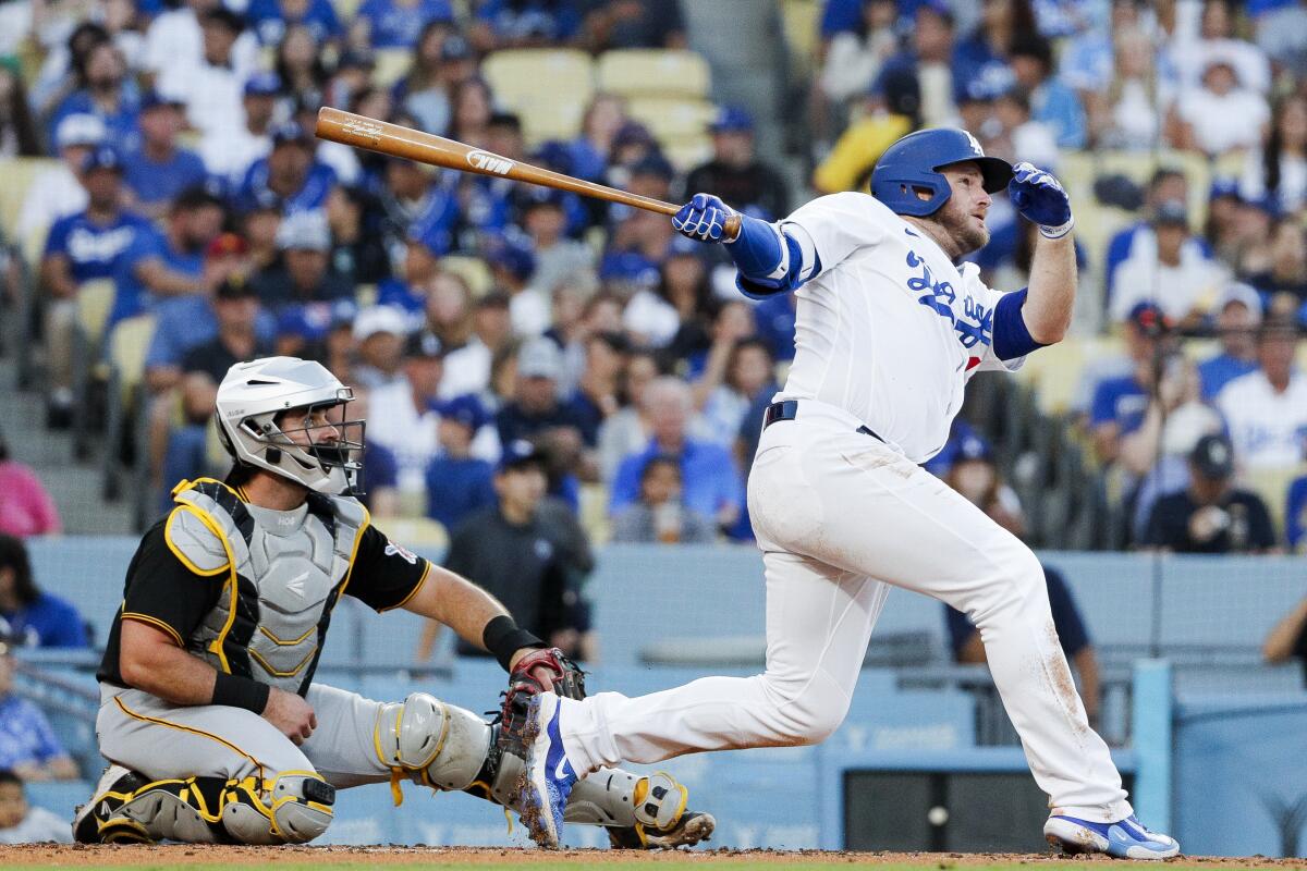 Max Muncy follows through on a solo home run against the Pittsburgh Pirates in July.