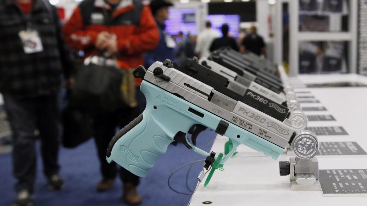 Handguns are on display at the National Rifle Assn. convention in Dallas on May 4.
