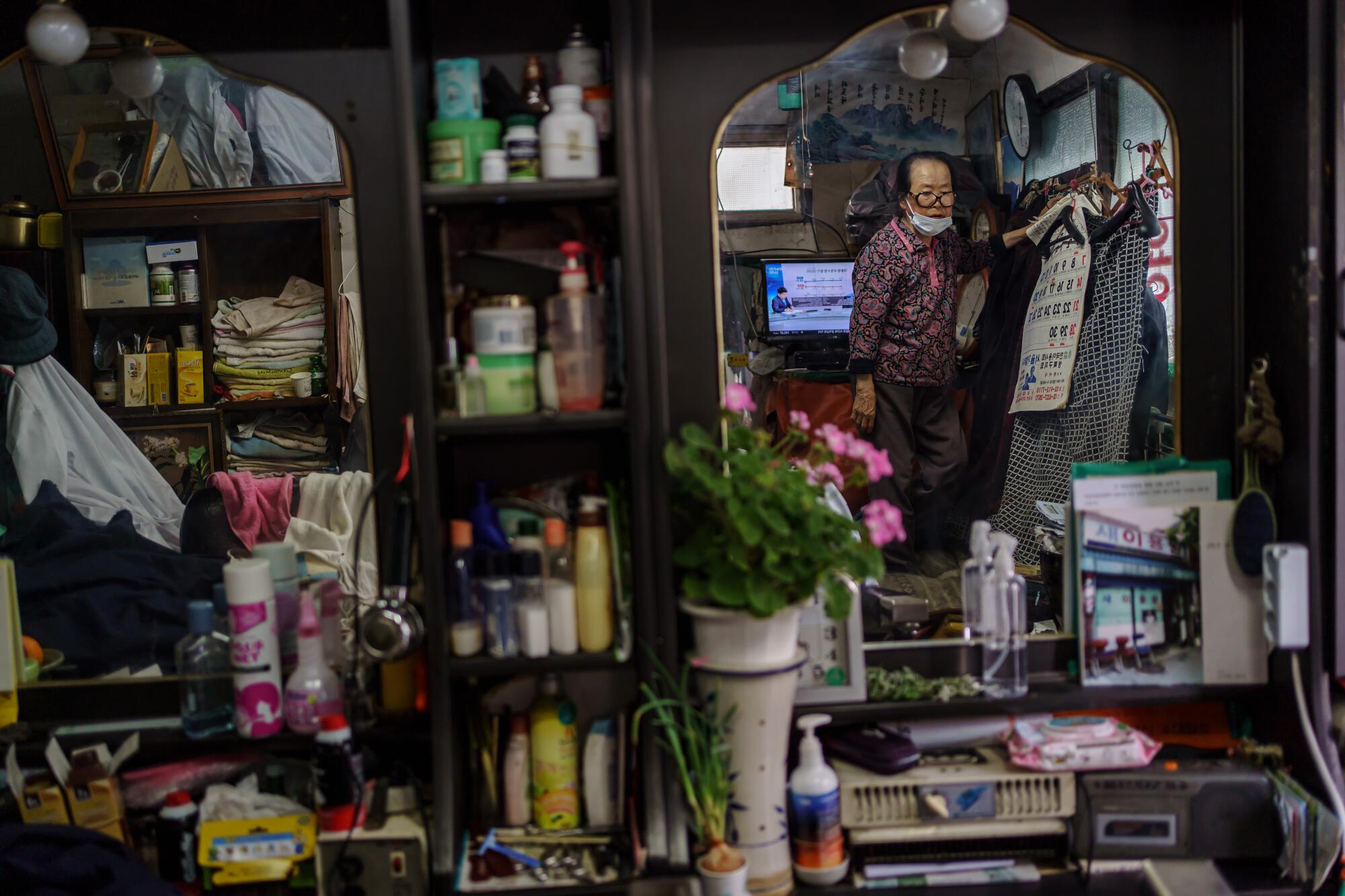 Lee Duk-hoon at her barbershop and living quarters in Seoul