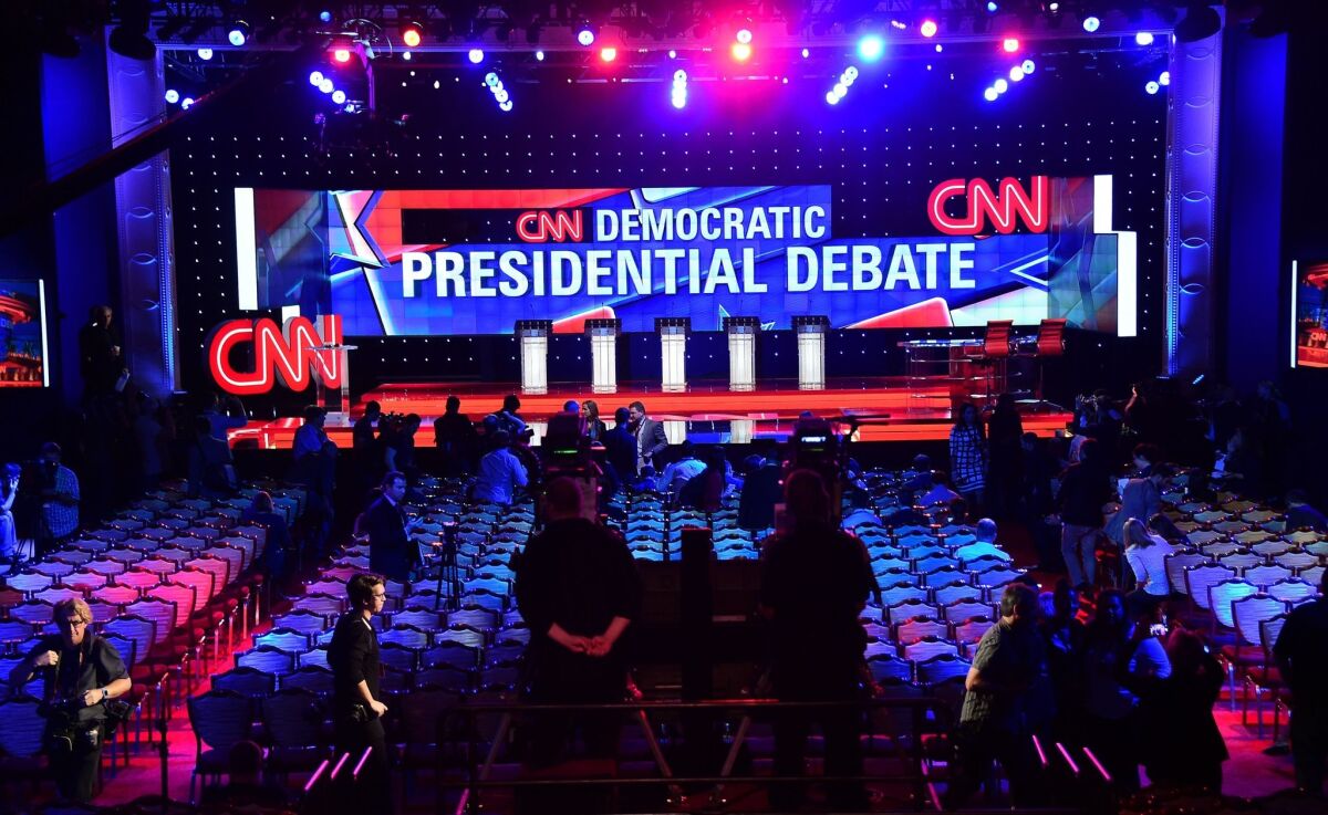 Members of the media are given a preview of the debate hall at the Wynn Hotel in Las Vegas hours before the first Democratic presidential debate.