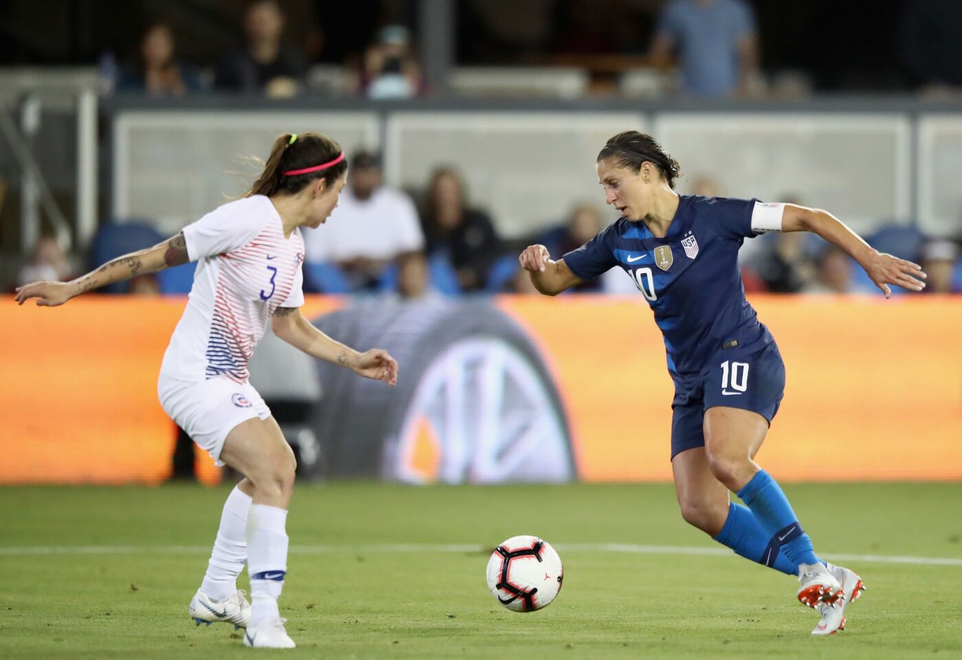 SAN JOSE, CA - SEPTEMBER 04: Carli Lloyd of the United States gets past Carla Guerrero of Chile to score her second goal during their match at Avaya Stadium on September 4, 2018 in San Jose, California. (Photo by Ezra Shaw/Getty Images) ** OUTS - ELSENT, FPG, CM - OUTS * NM, PH, VA if sourced by CT, LA or MoD **
