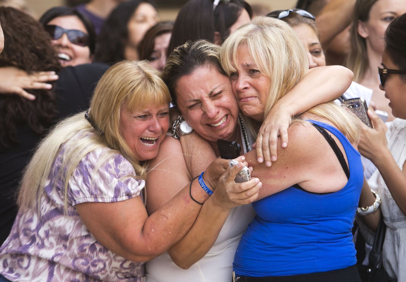 Kathy Brown, Virginia Aguiar and Jane Crook, react to a guilty verdict for Jodi Arias outside of Maricopa County Superior Court in Phoenix. Arias was convicted of first-degree murder in the gruesome killing of her one-time boyfriend in Arizona after a four-month trial that captured headlines with lurid tales of sex, lies, religion and a salacious relationship that ended in a blood bath.