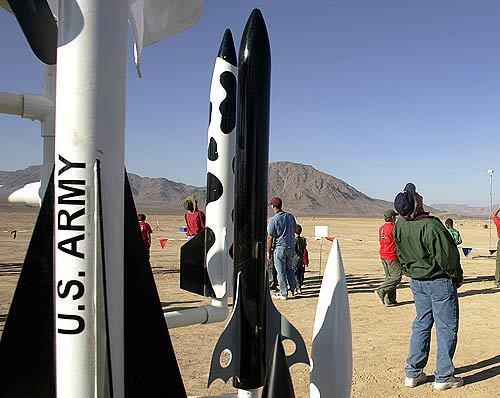 Scores of enthusiasts turn out for a model rocket competition at the federally managed Lucerne Dry Lake east of Victorville. The twice-a-year ROCstock is emblematic of the transformation of what used to be a simple boyhood hobby into extreme rocketry.