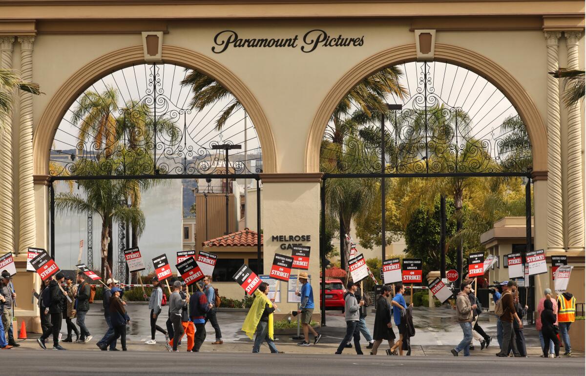 About 20 members of the Writers Guild carry pickets in front of the main Paramount Studio gate in Los Angeles May 4. 