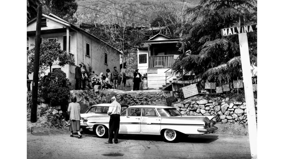 April 14, 1959: Several weeks before the eviction, residents of Malvina Avenue gather while waiting for the next move in the legal battle.